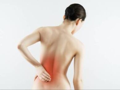 Back pain in the lumbar region of a woman
